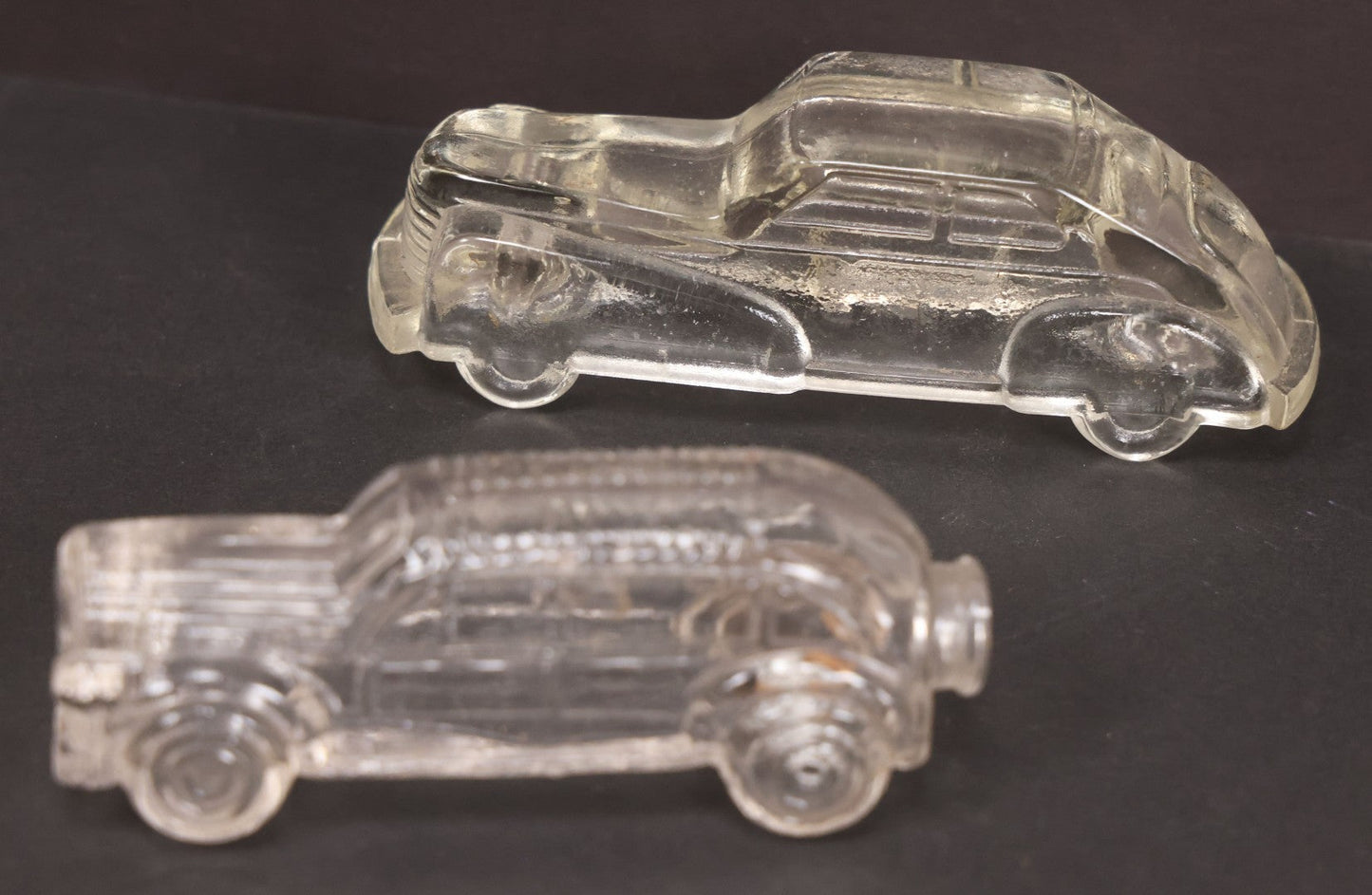 Lot 157 - Pair Of Vintage Clear Glass Automobile Candy Containers