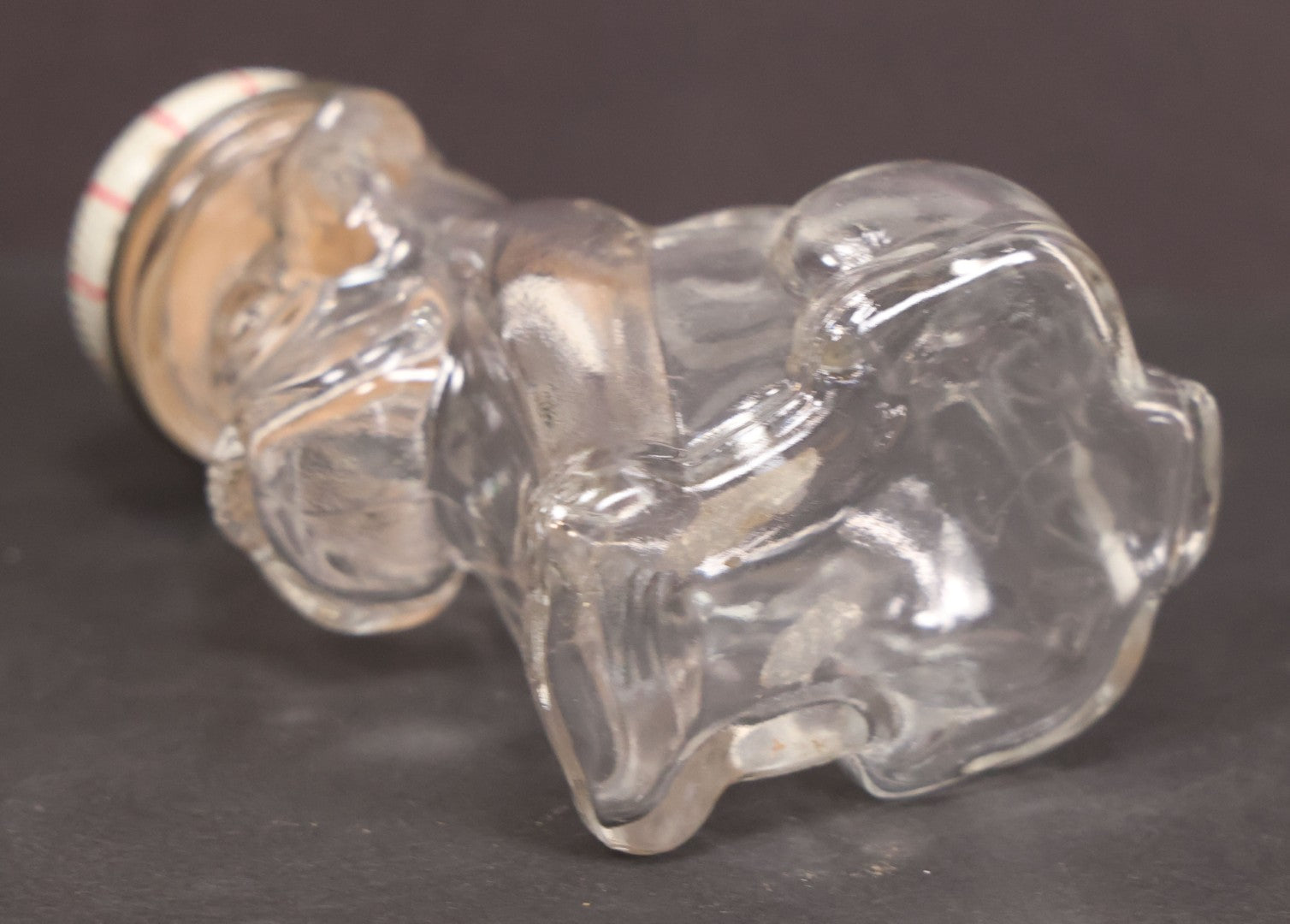 Lot 161 - Vintage Clear Glass Scottie Dog Candy Container With Original White And Red Metal "M.L." Twist Cap, 3-5/8" Height