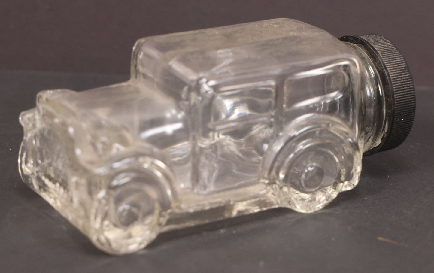 Lot 162 - Vintage Clear Glass Automobile Candy Container With Black Plastic Twist Cap, 4-3/4" Length
