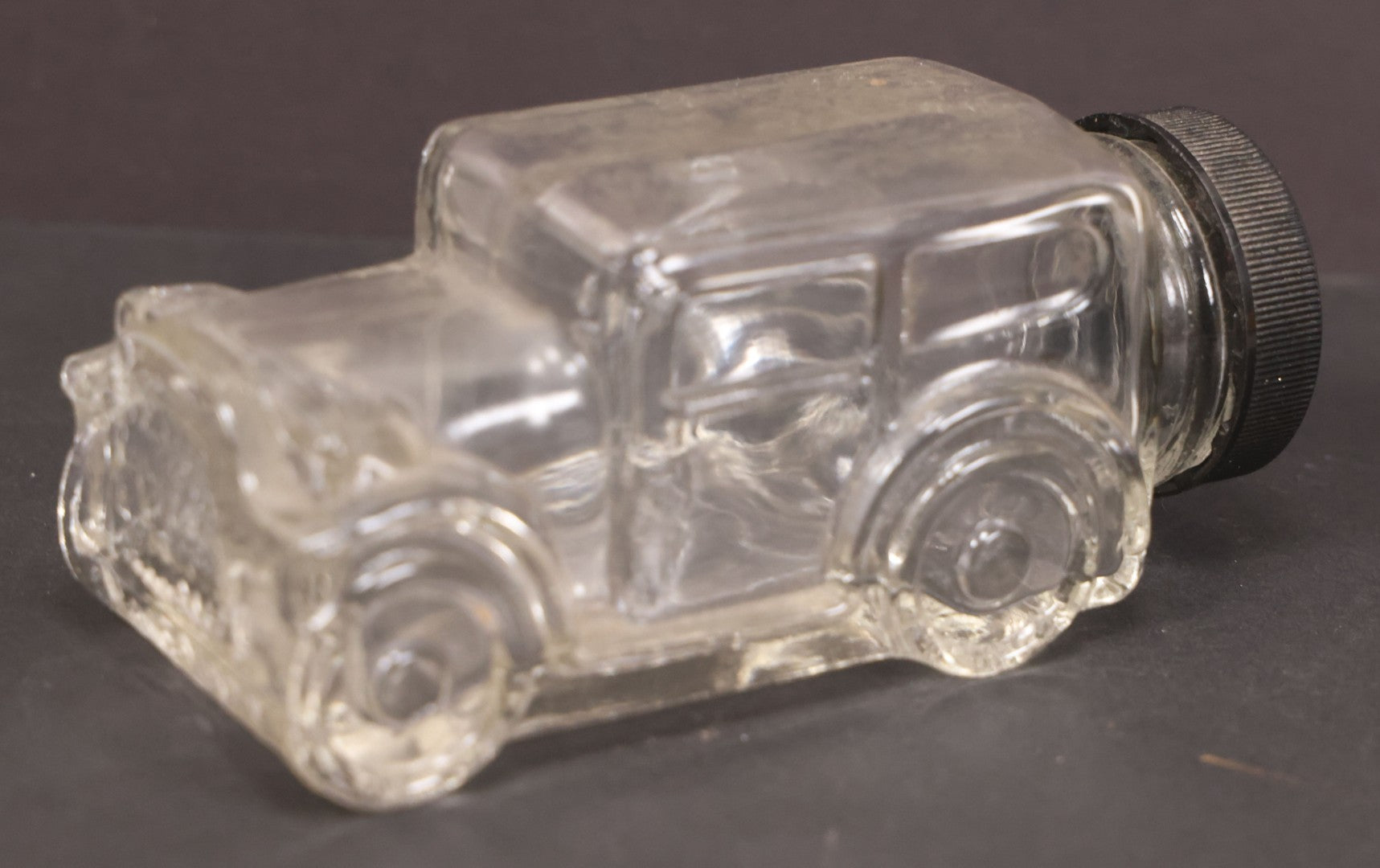 Lot 162 - Vintage Clear Glass Automobile Candy Container With Black Plastic Twist Cap, 4-3/4" Length