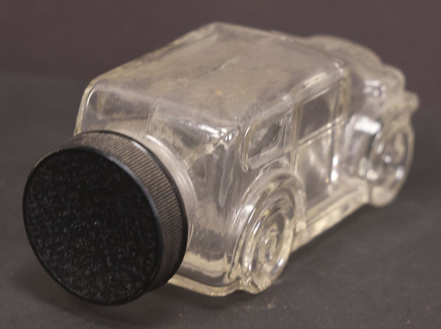 Lot 162 - Vintage Clear Glass Automobile Candy Container With Black Plastic Twist Cap, 4-3/4" Length