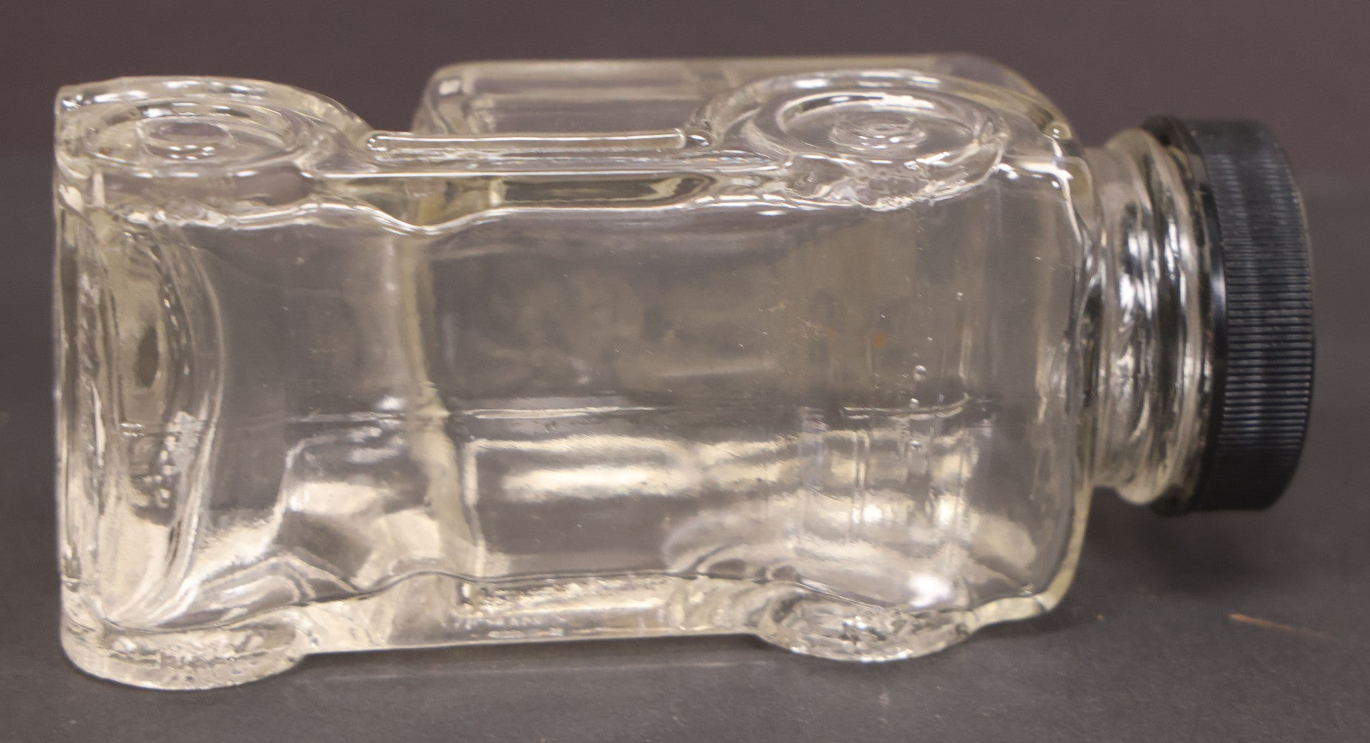 Lot 162 - Vintage Clear Glass Automobile Candy Container With Black Plastic Twist Cap, 4-3/4" Length