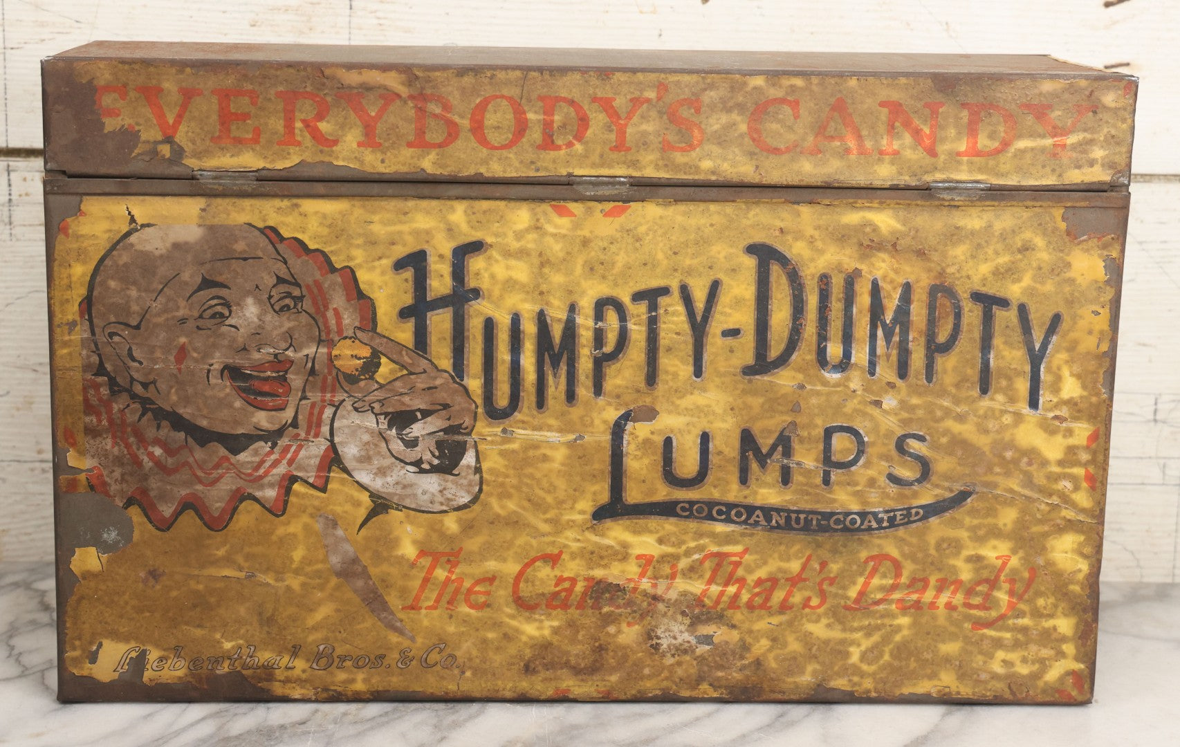 Lot 011 - Vintage Humpty-Dumpty Lumps, Cocoanut-Coated Candy Advertising Store Display Tin With Paper Labels, Clown Motif, "Everybody's Candy - The Candy That's Dandy," Liebenthal Bros. & Co., Note Severe Wear, Losses, Staining To Labels