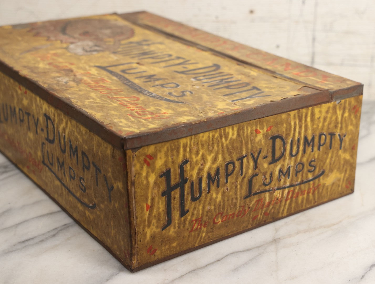 Lot 011 - Vintage Humpty-Dumpty Lumps, Cocoanut-Coated Candy Advertising Store Display Tin With Paper Labels, Clown Motif, "Everybody's Candy - The Candy That's Dandy," Liebenthal Bros. & Co., Note Severe Wear, Losses, Staining To Labels