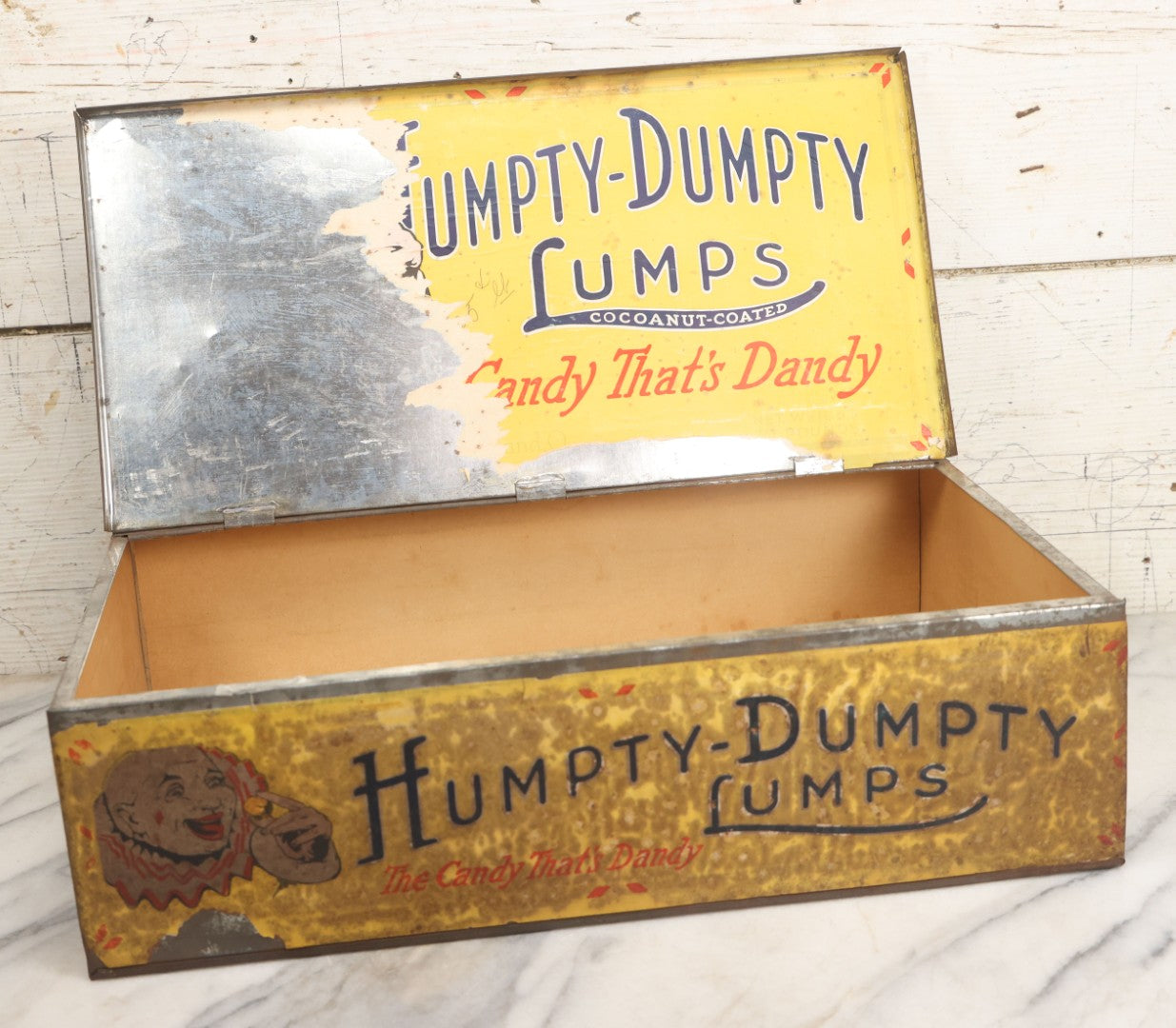 Lot 011 - Vintage Humpty-Dumpty Lumps, Cocoanut-Coated Candy Advertising Store Display Tin With Paper Labels, Clown Motif, "Everybody's Candy - The Candy That's Dandy," Liebenthal Bros. & Co., Note Severe Wear, Losses, Staining To Labels