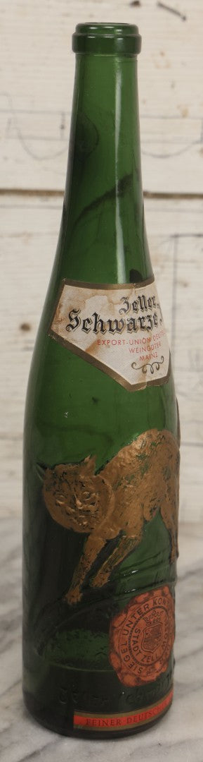 Lot 043 - Vintage Green Glass Embossed Wine Bottle With Painted Cat Motif, Zeller Schwarze Katz, Light Mosel Wine, Product, Bottled, And Shipped By Export Union Deutscher Weinguter, Mainz, Germany, 1966