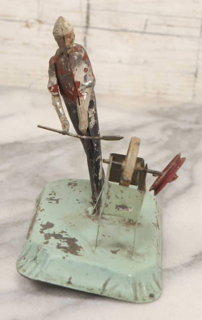 Lot 049 - Antique German Tin Occupational Toy, Man Working At Grinding Wheel, Note Paint Losses, Other Wear