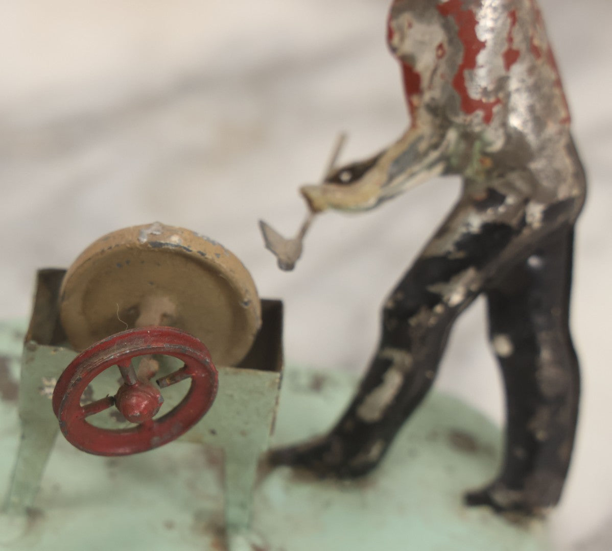 Lot 049 - Antique German Tin Occupational Toy, Man Working At Grinding Wheel, Note Paint Losses, Other Wear