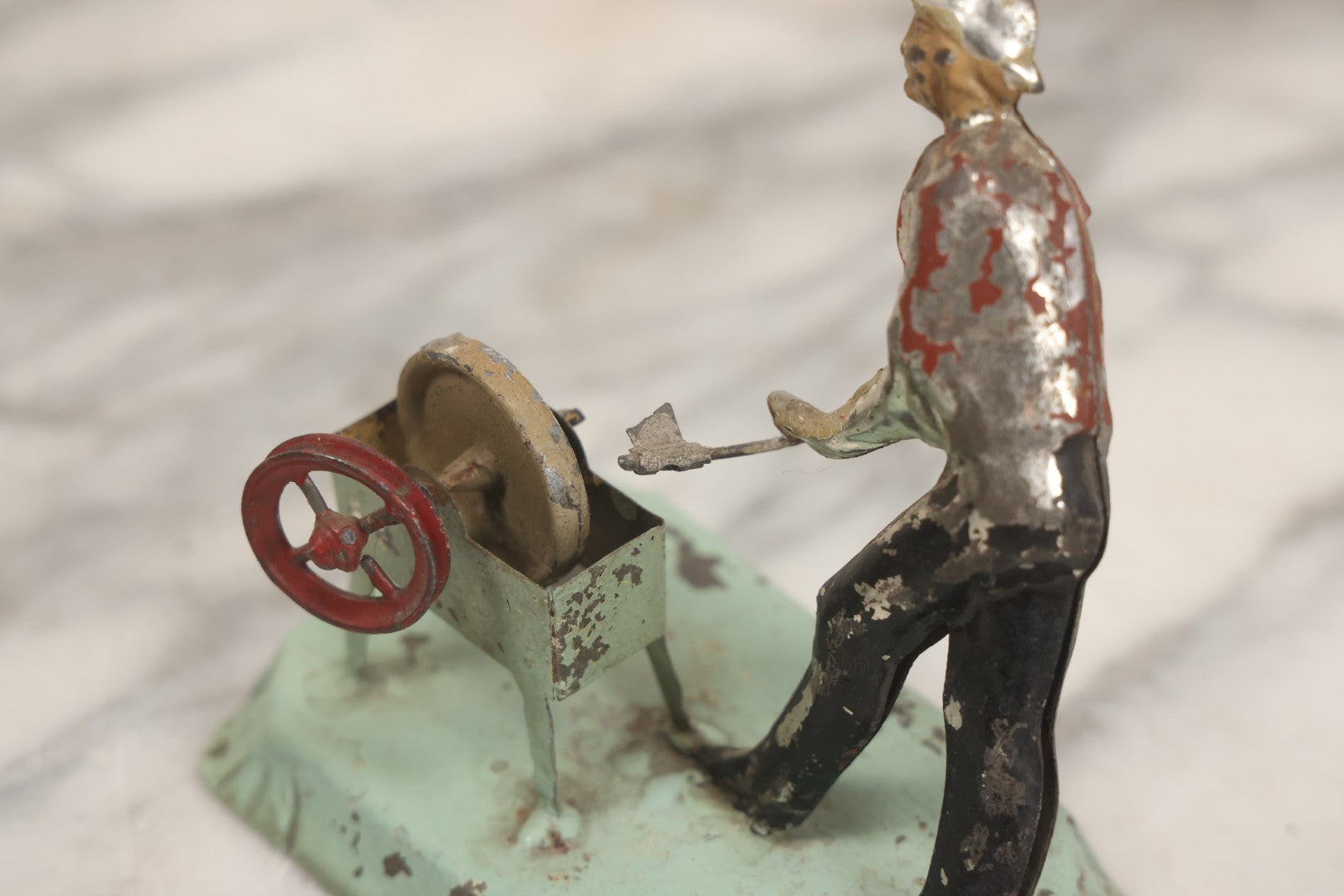 Lot 049 - Antique German Tin Occupational Toy, Man Working At Grinding Wheel, Note Paint Losses, Other Wear