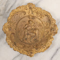 Lot 050 - Vintage Ornate Pressed Brass Repousse Catch All Tray With Nude Woman, Children, Marked L.W./S.U. On Verso, 7-3/8" Diameter