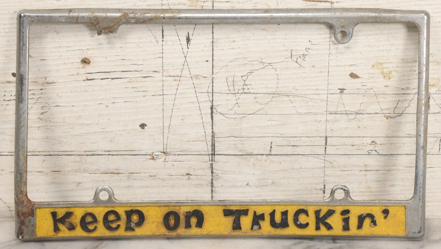 Lot 055 - Vintage "Keep On Truckin'" Metal License Plate Frame Topper