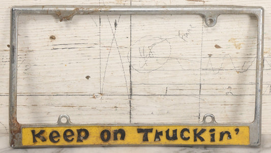 Lot 055 - Vintage "Keep On Truckin'" Metal License Plate Frame Topper