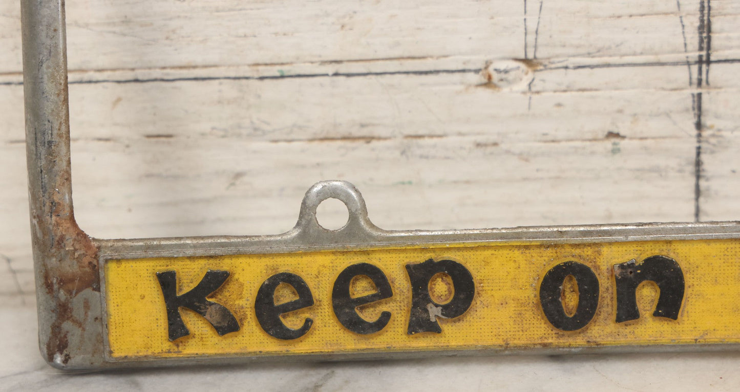 Lot 055 - Vintage "Keep On Truckin'" Metal License Plate Frame Topper
