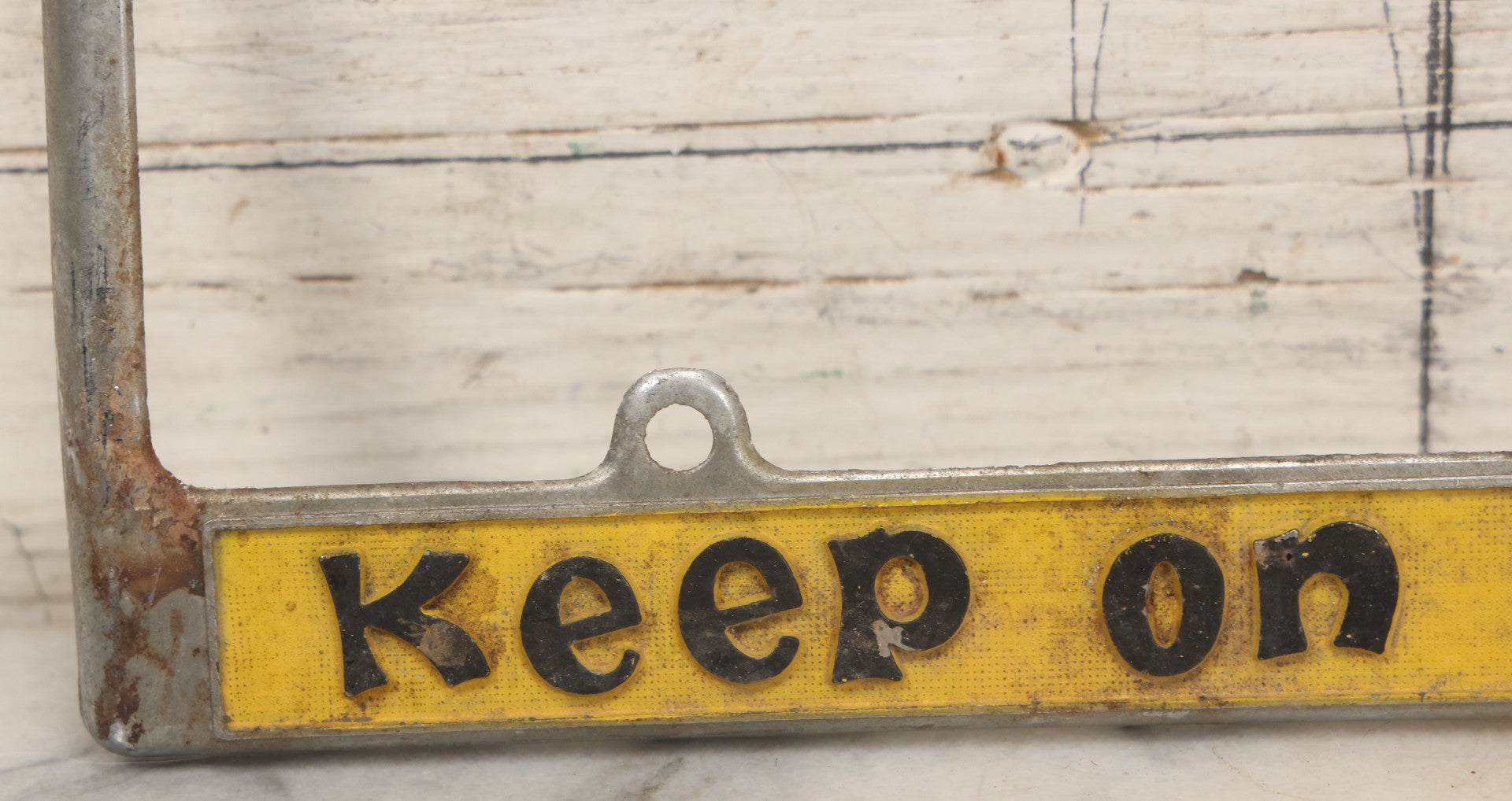 Lot 055 - Vintage "Keep On Truckin'" Metal License Plate Frame Topper