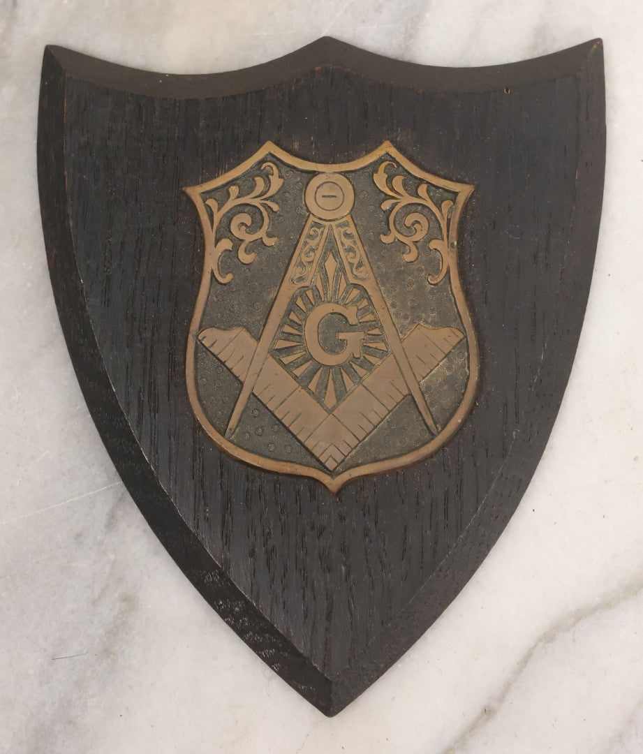Lot 057 - Vintage Cast Brass Masonic Compass And Square Insignia Symbol Mounted To Wood Shield, Paperweight, Partial Paper Label On Verso, Boston