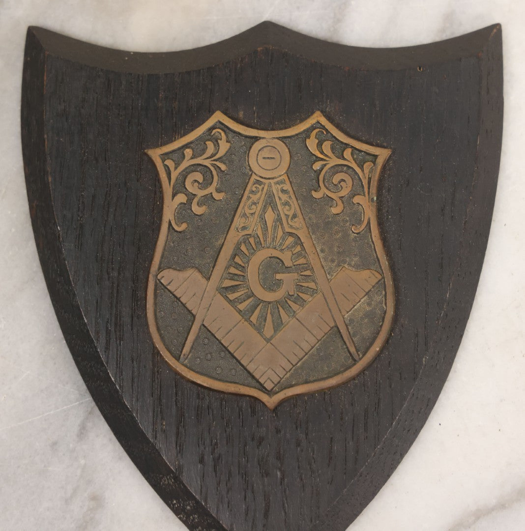 Lot 057 - Vintage Cast Brass Masonic Compass And Square Insignia Symbol Mounted To Wood Shield, Paperweight, Partial Paper Label On Verso, Boston
