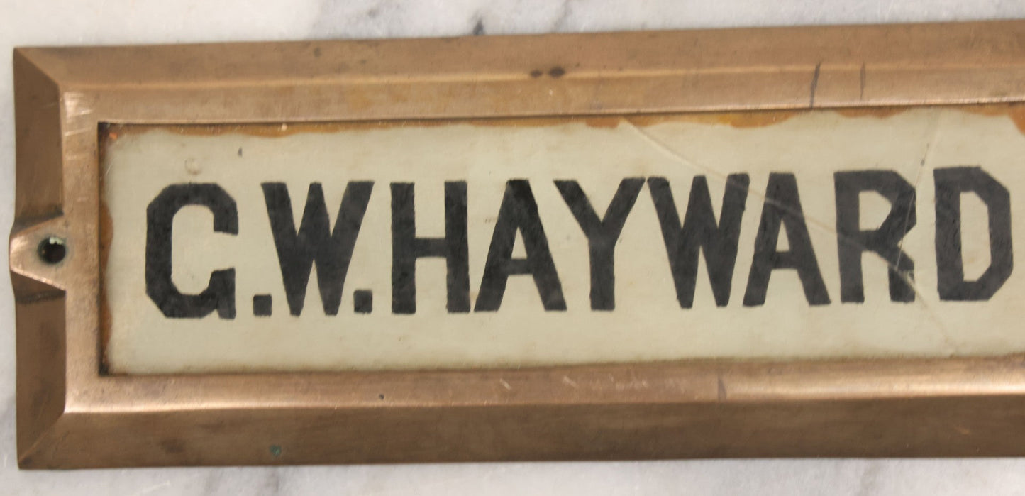 Lot 062 - Vintage Reverse Painted Name Plate Door Tag For G.W. Hayward In Brass Mounting Frame, Not Cracked