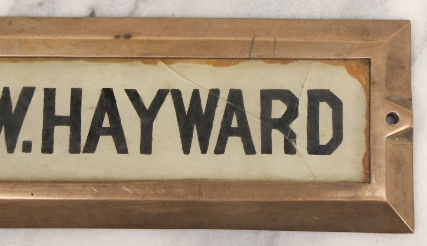 Lot 062 - Vintage Reverse Painted Name Plate Door Tag For G.W. Hayward In Brass Mounting Frame, Not Cracked