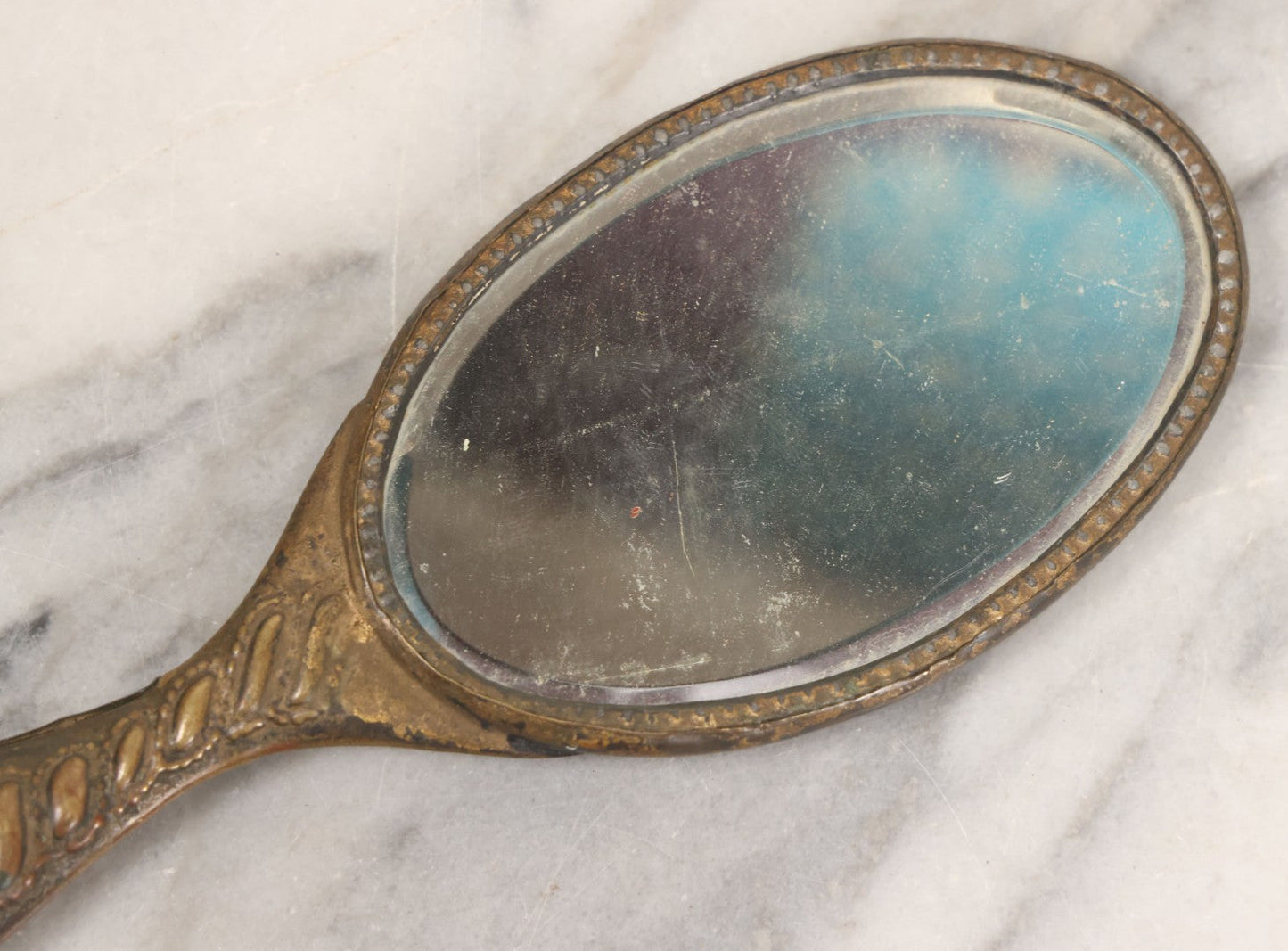 Lot 063 - Antique Pressed Brass Repousse Hand Mirror