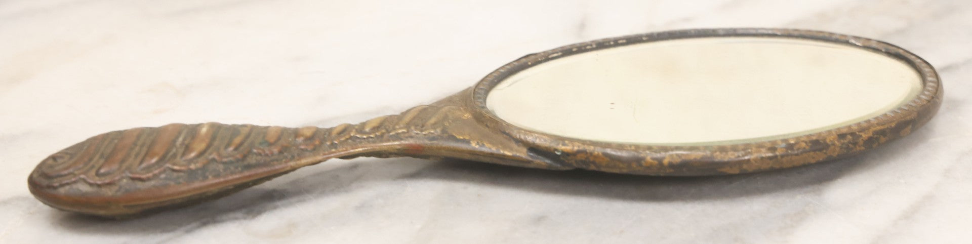 Lot 063 - Antique Pressed Brass Repousse Hand Mirror
