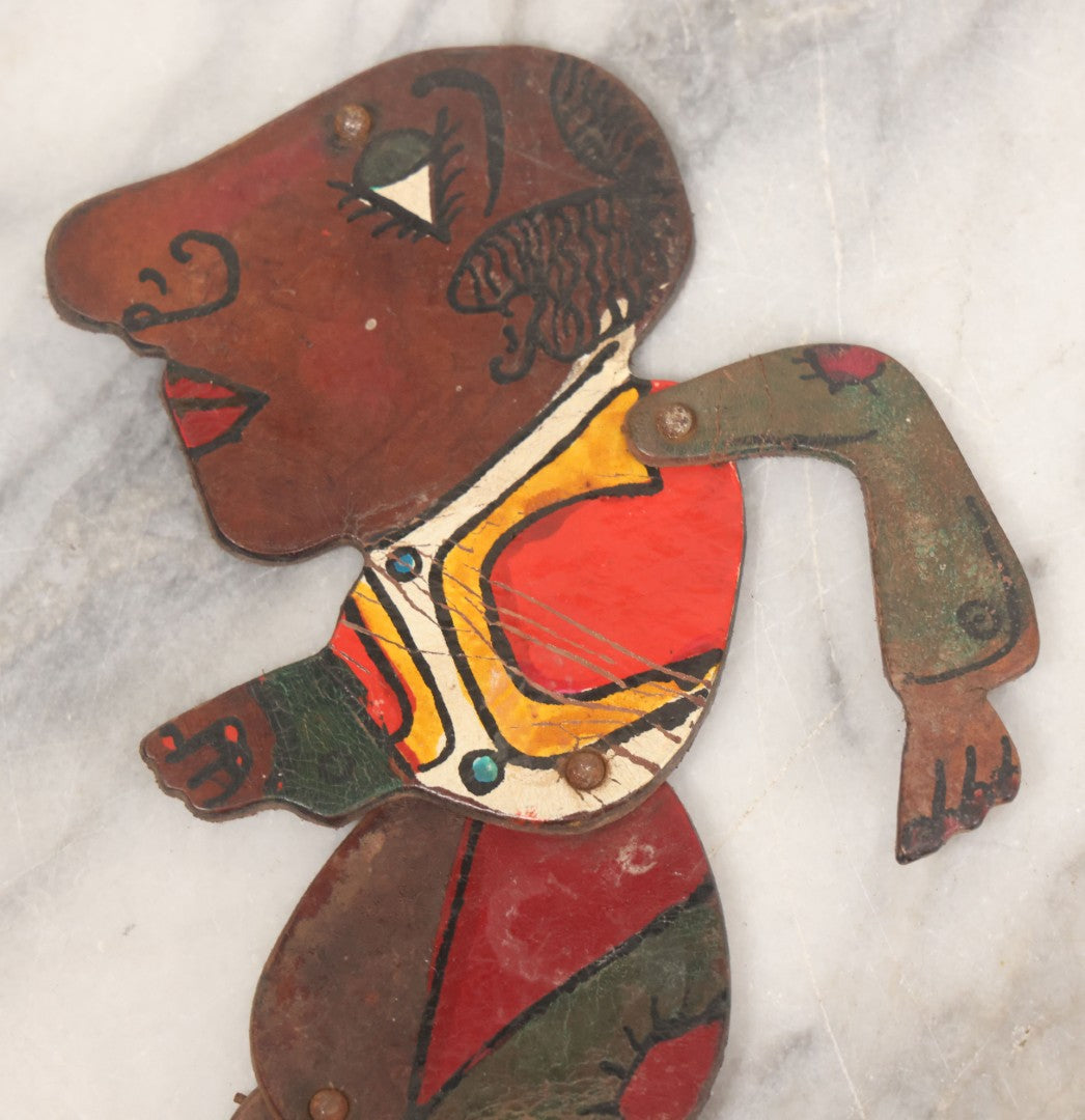 Lot 073 - Antique Hand Cut, Hand Painted Leather Jointed Puppet With Hair Legs