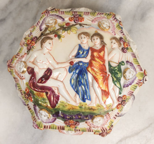 Lot 105 -  Vintage Capodimonte Style Porcelain Lidded Box With Three Graces Relief And Cherub Masks