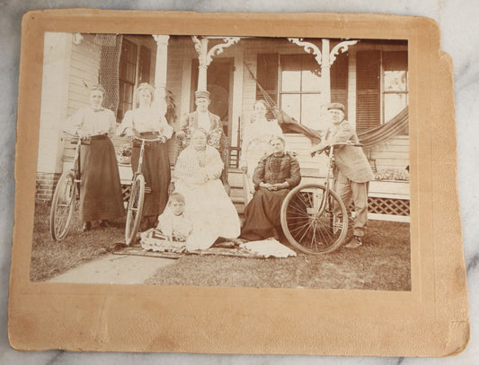 Lot 126 - Antique Boarded Photograph Of Men And Women Posing With Bicycles In Front Of Porch With Hammock, Identified On Verso