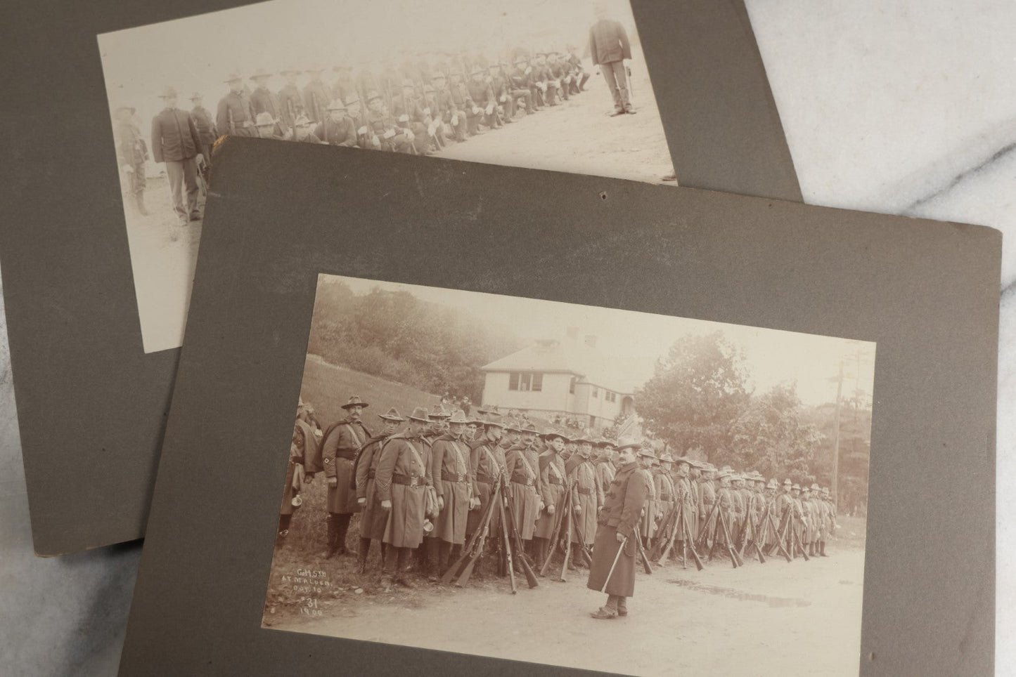 Lot 129 - Pair Of Antique Boarded Photographs Of Military Soldiers In Formation With Officer, Rifles In Frame, Circa 1890