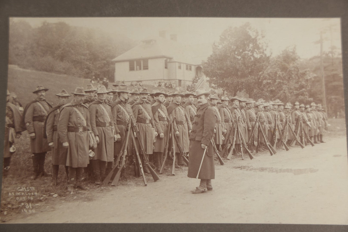 Lot 129 - Pair Of Antique Boarded Photographs Of Military Soldiers In Formation With Officer, Rifles In Frame, Circa 1890