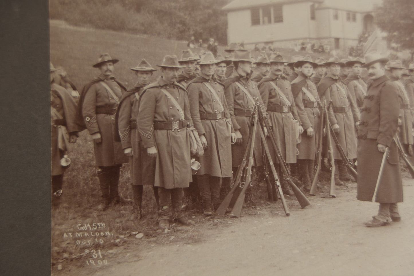 Lot 129 - Pair Of Antique Boarded Photographs Of Military Soldiers In Formation With Officer, Rifles In Frame, Circa 1890