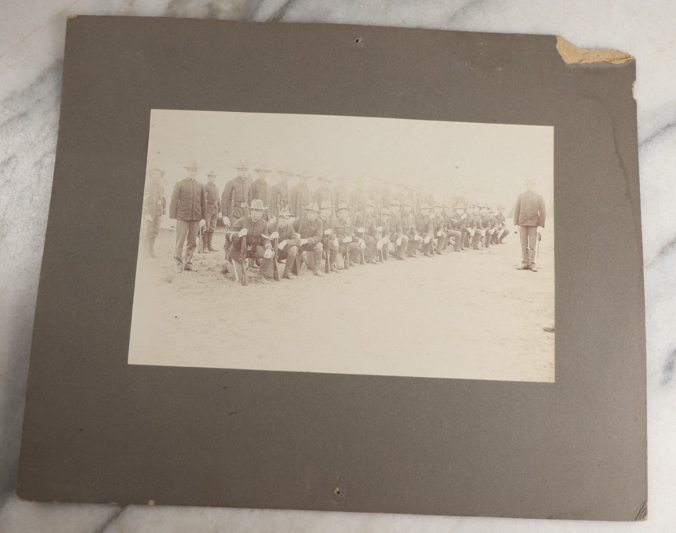 Lot 129 - Pair Of Antique Boarded Photographs Of Military Soldiers In Formation With Officer, Rifles In Frame, Circa 1890