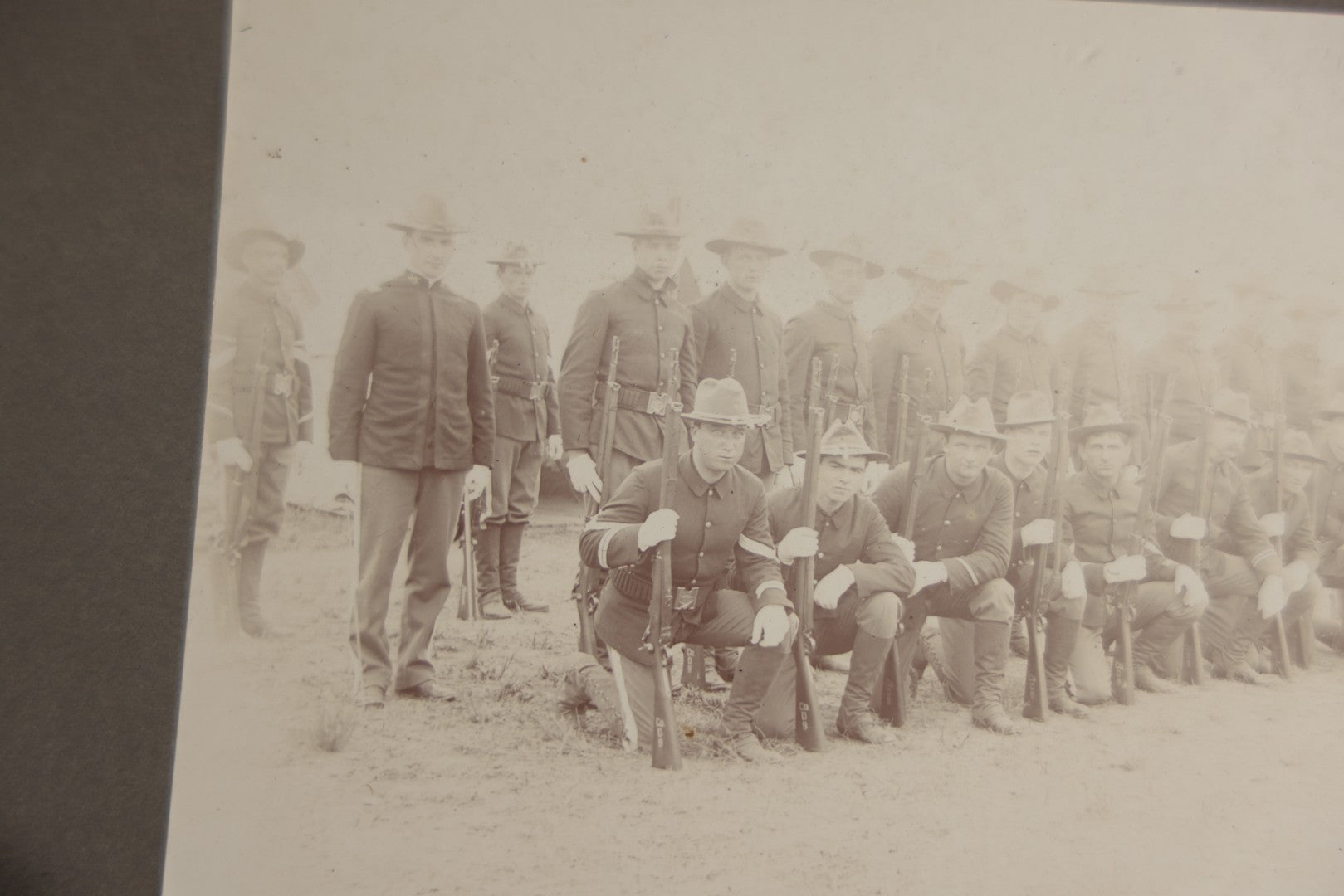 Lot 129 - Pair Of Antique Boarded Photographs Of Military Soldiers In Formation With Officer, Rifles In Frame, Circa 1890