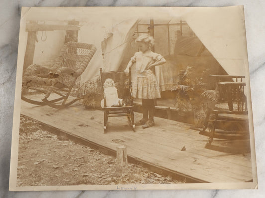 Lot 132 - Antique Unmounted Photograph Of A Little Girl With Her Doll Standing On A Tent Porch