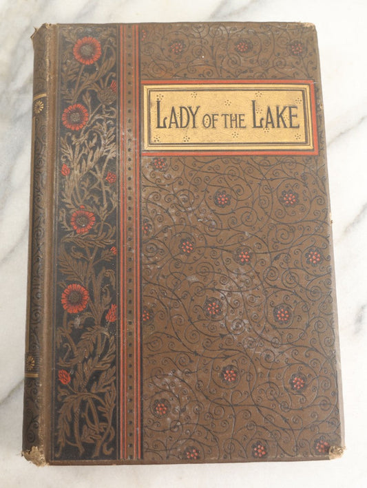 Lot 134 - "The Lady Of The Lake" Antique Poetry Book By Sir Walter Scott, Illustrated, Decorative Brown Cloth Boards With Red And Black Floral And Scroll Design, Gilt Title Panel, Nims & Knight, Publishers, Troy, N.Y., 1884