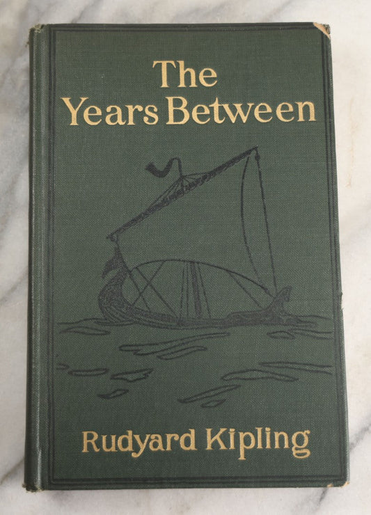 Lot 139 - "The Years Between" Antique Poetry Book By Rudyard Kipling, Green Cloth Boards With Gilt Title And Black Pictorial Sailing Ship Motif, Doubleday, Page & Company, Garden City, New York, 1919