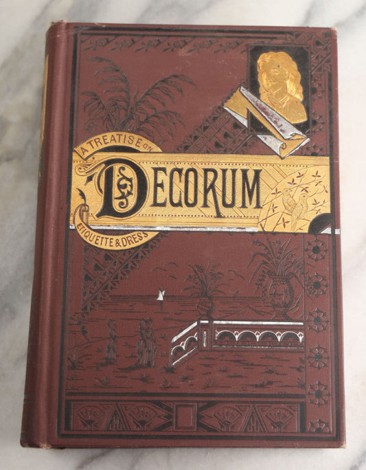 Lot 162 - "Decorum: A Practical Treatise On Etiquette And Dress Of The Best American Society" Antique Book By Richard A. Wells, Profusely Illustrated, With Debossed, Colored Cover Boards, Union Publishing House, New York, 1886