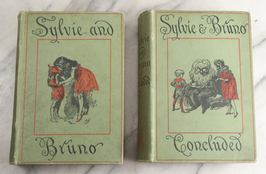Lot 188 - Pair Of Antique Books, "Sylvie And Bruno" And "Sylvie And Bruno Concluded" By Lewis Carroll, Matching Illustrated Green Cloth Covers With Red And Black Designs, Macmillan And Co., Limited, Publisher, London, 1898