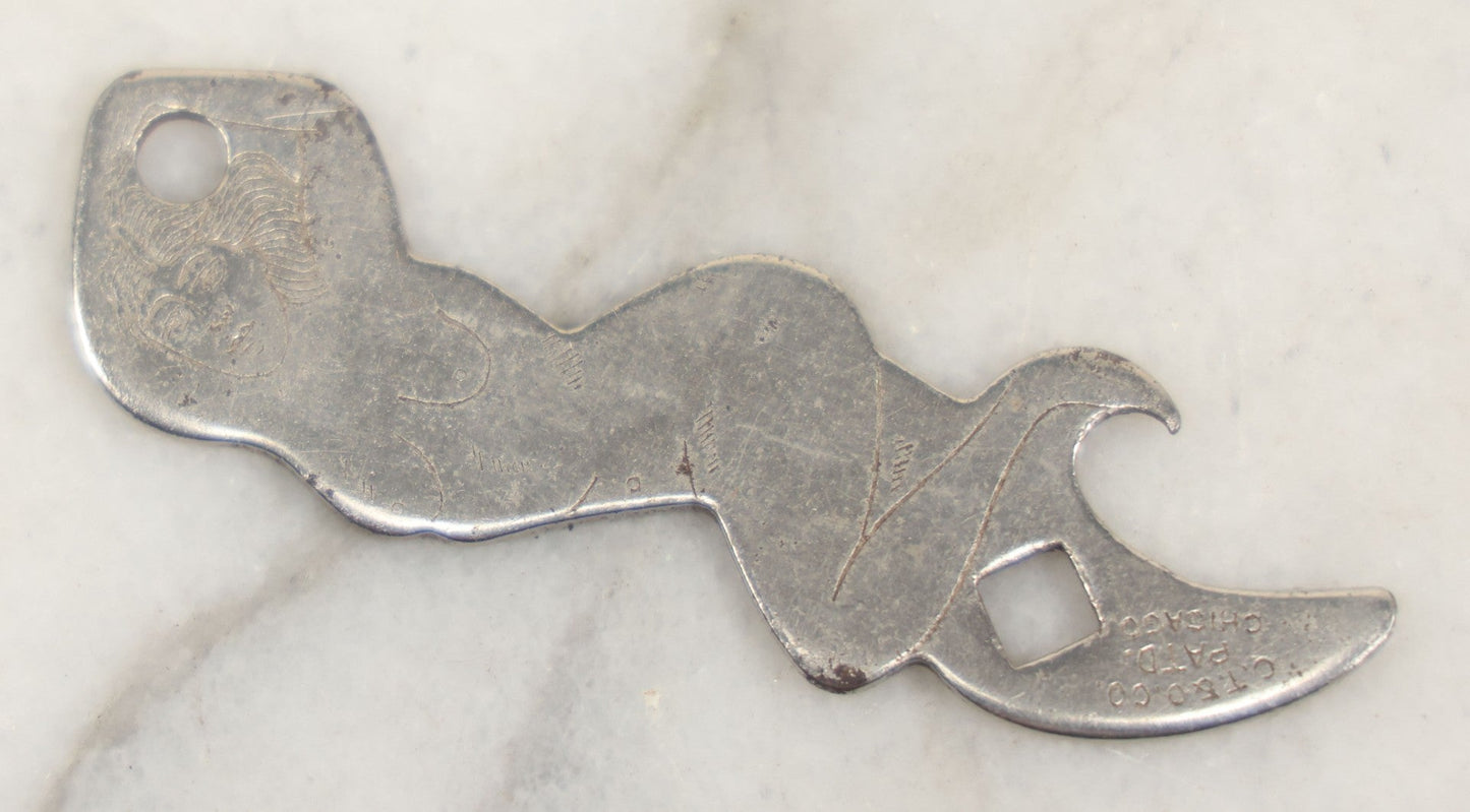 Lot 205 - Vintage Novelty Risque Pin Up Metal Advertising Bottle Opener, Advertising The Gibson Bar, Omaha, Nebraska