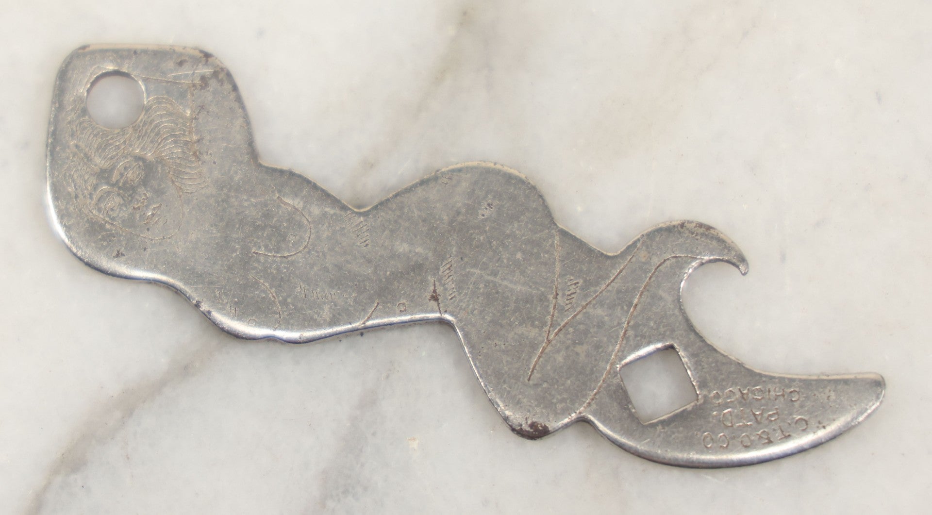 Lot 205 - Vintage Novelty Risque Pin Up Metal Advertising Bottle Opener, Advertising The Gibson Bar, Omaha, Nebraska