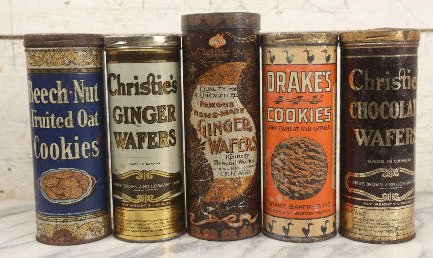 Lot 226 - Grouping Of Five Vintage Cookie And Wafer Tube Advertising Tins Including Beech-Nut Cookies, Christie's Ginger Wafers, Kennedy Ginger Wafers, Drake's Cookies, And Christie's Chocolate Wafers