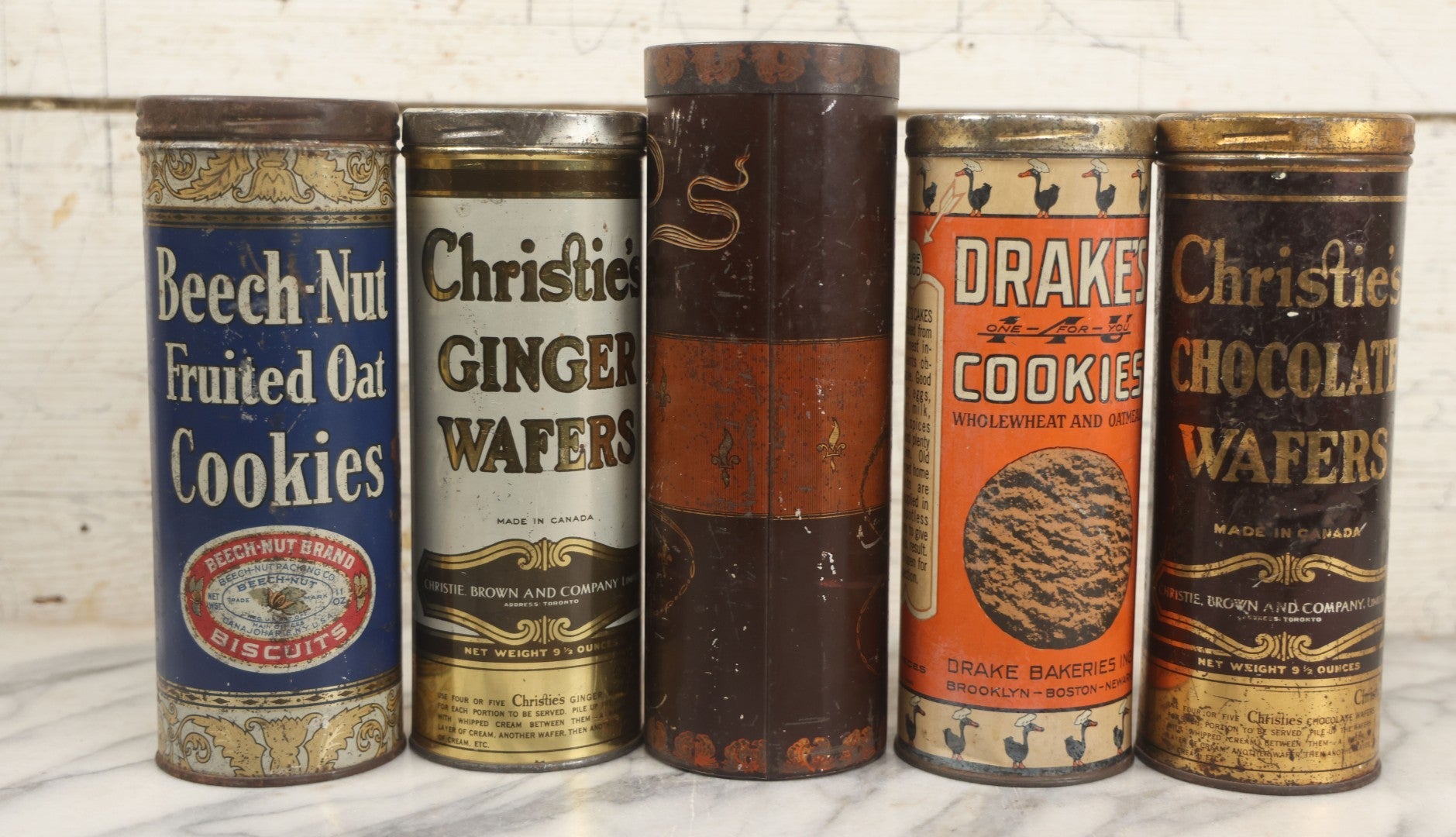 Lot 226 - Grouping Of Five Vintage Cookie And Wafer Tube Advertising Tins Including Beech-Nut Cookies, Christie's Ginger Wafers, Kennedy Ginger Wafers, Drake's Cookies, And Christie's Chocolate Wafers