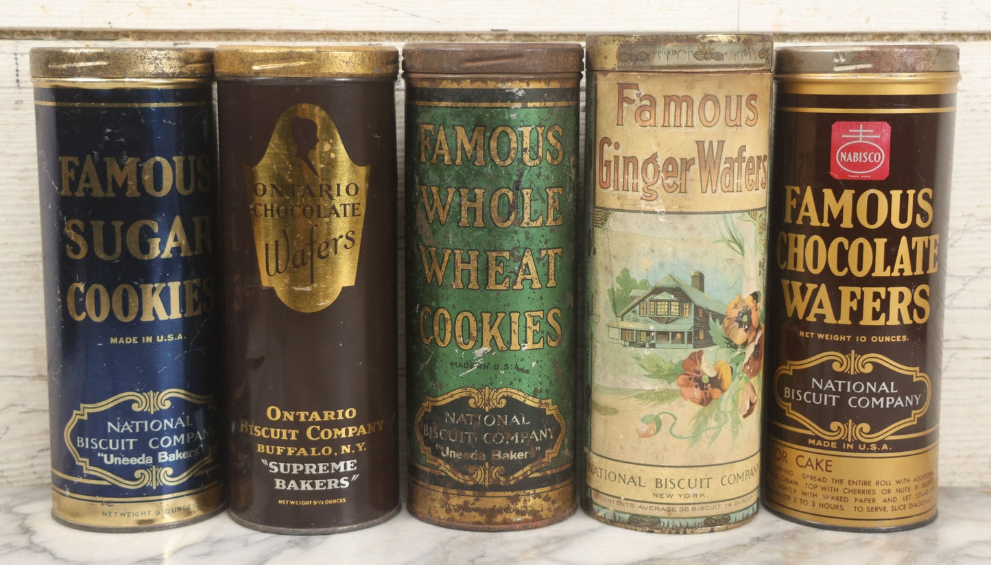Lot 227 - Grouping Of Five Vintage Cookie And Wafer Tube Advertising Tins Including Famous Sugar Cookies, Ontario Chocolate Wafers, Famous Whole Wheat Cookies, Famous Ginger Wafers, And Famous Chocolate Wafers, National Biscuit Company