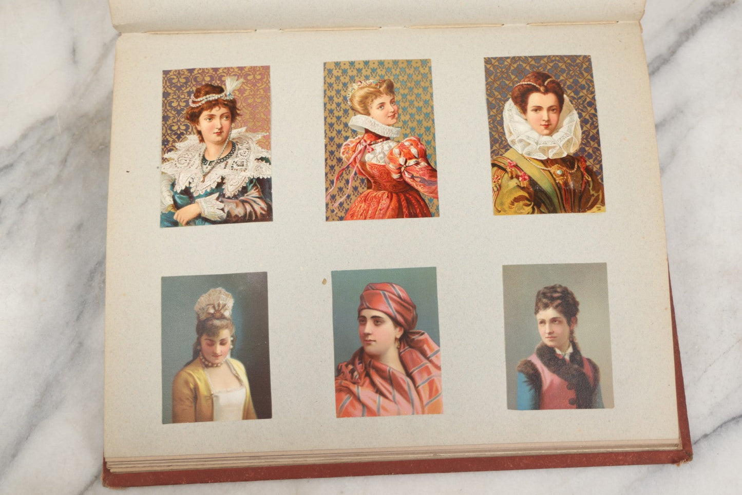 Lot 238 - Antique Victorian Scrapbook Containing Approximately Pieces, Mostly Bold Chromolithographs Of Beautiful Women, Nicely Organized
