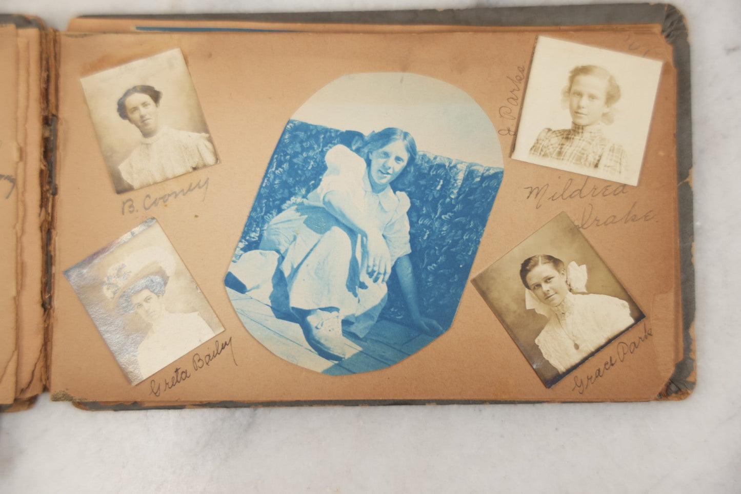 Lot 241 - Antique Snapshot And Cyanotype Photo Album Contained In A Victorian Autograph Book, Containing Photos Of The Students Of West Newbury High School, Massachusetts, Including Creative Group Shots, Beach Scenes, Playful Friends, And More