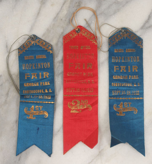 Lot 245 - Grouping Of Three Antique Prize Ribbons From The Eighth Annual Hopkinton Fair, George Park, Contoocook, New Hampshire, September 1922, Two Blue First Prize Badges, One Red Second Prize, Made By The Sommer Badge Mfg. Co., Newark, New Jersey
