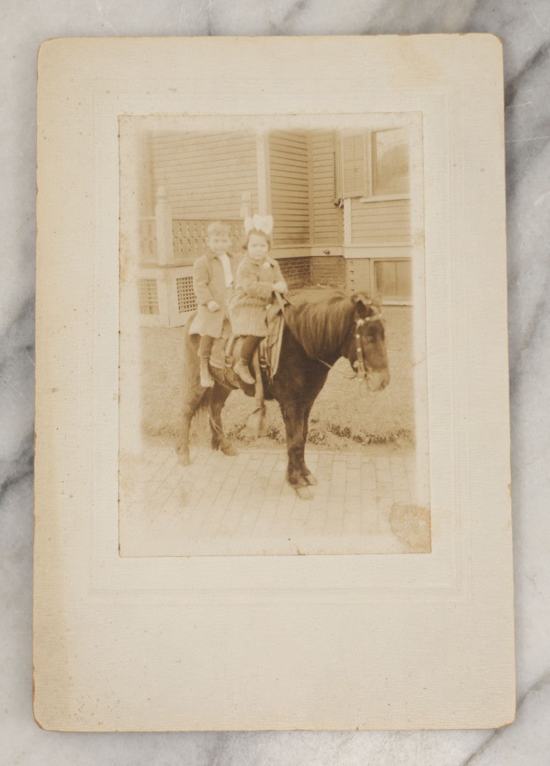 Lot 249 - Single Antique Boarded Photograph Of Two Toddlers Riding A Mini Horse, Circa 1895, Identified On Verso