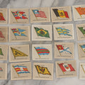 Lot 254 - Grouping Of Twenty Antique Lithgraphed Trade Card Advertisements Showing The Flags Of The World, Advertising John Wanamaker & Co., Clothing, Philadelphia, Pennsylvania