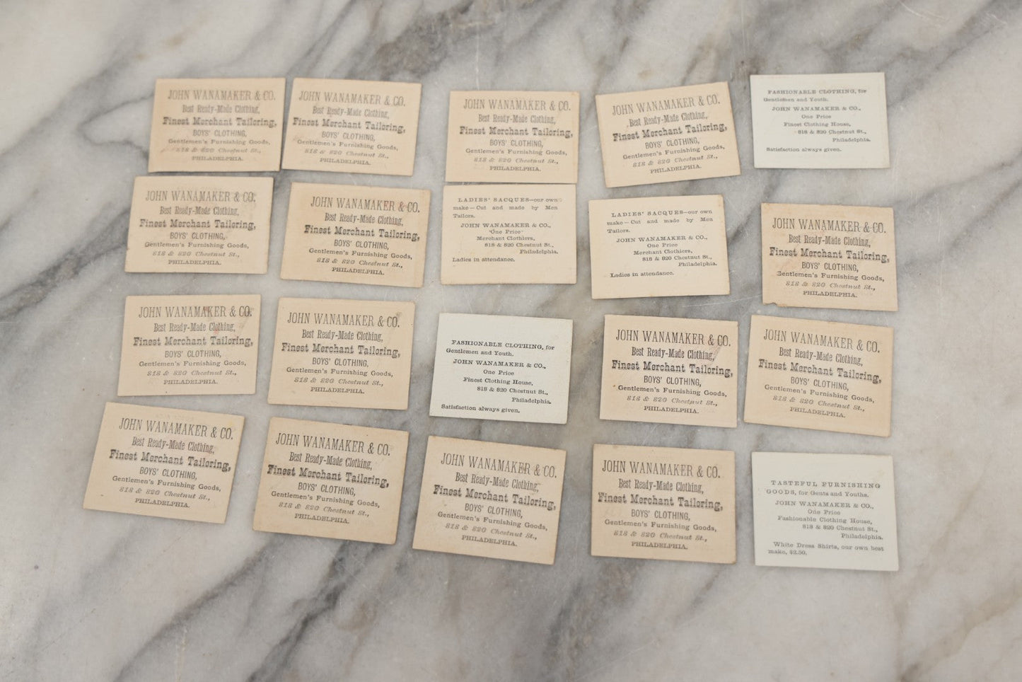 Lot 254 - Grouping Of Twenty Antique Lithgraphed Trade Card Advertisements Showing The Flags Of The World, Advertising John Wanamaker & Co., Clothing, Philadelphia, Pennsylvania 