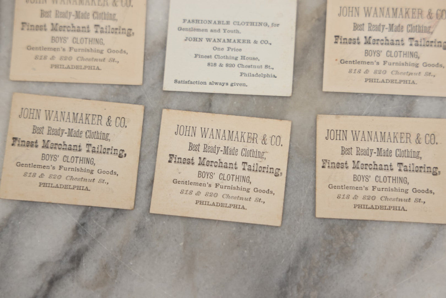 Lot 254 - Grouping Of Twenty Antique Lithgraphed Trade Card Advertisements Showing The Flags Of The World, Advertising John Wanamaker & Co., Clothing, Philadelphia, Pennsylvania 