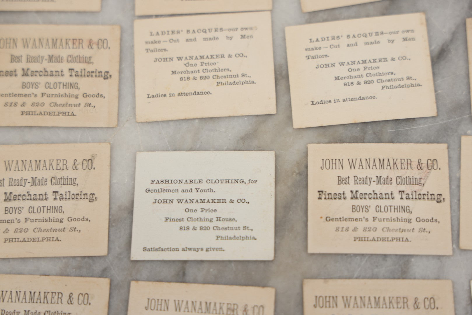 Lot 254 - Grouping Of Twenty Antique Lithgraphed Trade Card Advertisements Showing The Flags Of The World, Advertising John Wanamaker & Co., Clothing, Philadelphia, Pennsylvania 